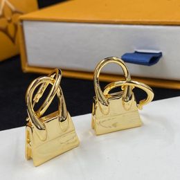 Avec la boîte 2022 Femmes designers Design Sac Sac de conception 18k boucles d'oreilles de luxe plaquées dorées Couper de boucles d'oreille de mariage Gips 246a