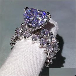 Con piedras laterales anillos de lujo para hombres anillo de compromiso de piedras preciosas para mujeres FL Diamond Heart Jewelry 2 Peice Set Dr Dhgarden Otkqa