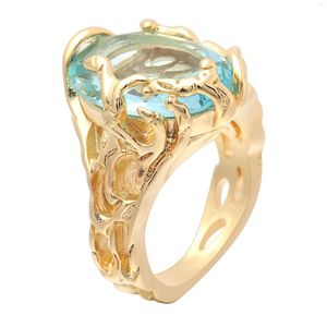 Avec des pierres latérales Seanlov creux couleur or femmes anneaux pavé grand bleu clair Cz Zircon cadeau de luxe bijoux doigt désherbage bague de fiançailles