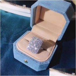 Avec des pierres latérales bijoux étincelants Unique Fine 925 Sterling Sier Fl T princesse coupe topaze blanche Cz diamant femmes bague Gi Dhhxi