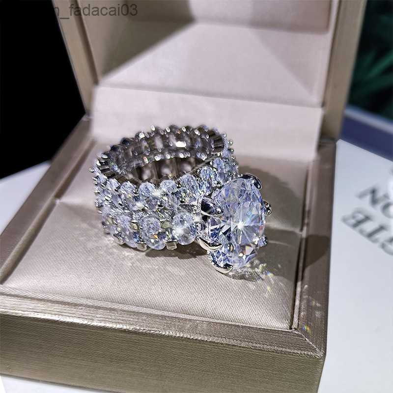 Yan taşlarla yan taşlarla yüksek kaliteli beyaz elmas iki set yüzüğü 925 Gümüş Kadınlar Bling Zircon Ring Düğün Partisi Nişan Mücevher Hediye 230411 Z230630