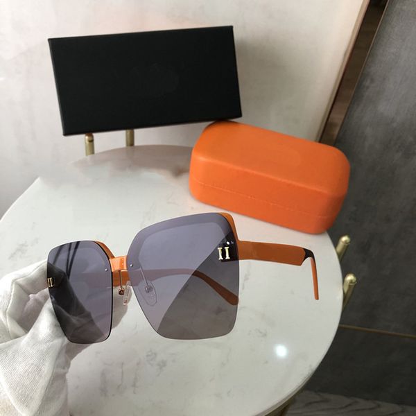 Mujer Diseñador Gafas de sol Gafas de sol naranjas Letras de metal Hombres Casual Dos estilos Marco grande con caja