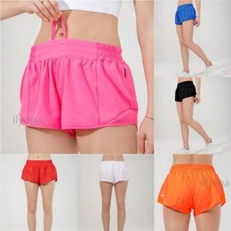 Pantalones cortos de tiro bajo para mujer, pantalones cortos de yoga transpirables de secado rápido, pantalones cortos deportivos con forro incorporado, bolsillos laterales con cremallera oculta, pantalones deportivos para correr con cordón continuo