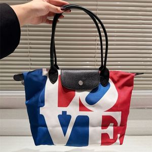 Vrouw love schoudertassen canvas handtas ontwerper tas luxe winkeltas grote capaciteit bakken mode contrast kleur 10a 2024