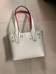 Vrouw printtassen meisjes schoudertassen echte lederen klinknagels spikes boog crossbody tote cabata designer merken kleine handtassen