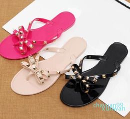 Sandalias de verano de mujer Big Bowknot Flip Flip Sandalias Sandalias Femininas Flat Jelly Designer Zapatos