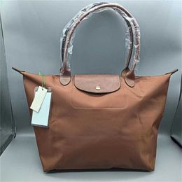 Billetera de mujer tienda liviana barata nylon 90% viajar fuera de comprador bolsas de compras al por mayor albóndigas impermeables simples bacos