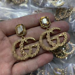 Vrouwen 18K gouden stud geplateerde luxe merkontwerpers Letters Geometrische beroemde damesronde Round Crystal Rhinestone Pearl Earring Wedding Party Joodlry GE-028