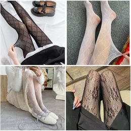 Vrouwen klassieke kousen accessoires mode brief / zonnebloem patroon sokken ins hot hosiery sexy vrouwen leggings hoge kwaliteit panty zwart en wit