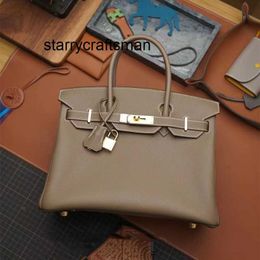 Sac à main femme éléphant gris sac avec fil ciré peau de vache togo Bk25/30cm cuir femme avec logo B K