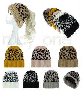 Femmes Leopard Tricoted Ponytail Caps Fashion Criss Cross Crosstail Pony Beanie Hiver Wool Wool Casual Knitting Hat Party Party Supply Rra5998302