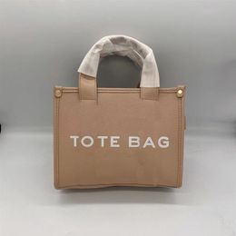 Femmes Marc fourre-tout Sacs à bandoulière Le sac fourre-tout en cuir célèbre sac à main Designer 2022 poignée supérieure dames sac à main lettre bandoulière Practic299z