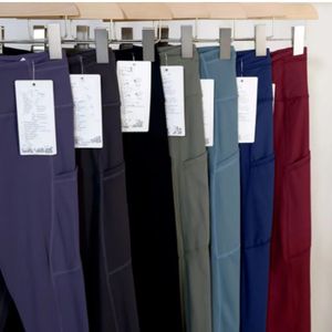 Pantalones de bolsillo para mujer, mallas de Yoga rápidas y gratuitas, pantalones deportivos elásticos de cintura alta, pantalones casuales hasta el tobillo con bandas