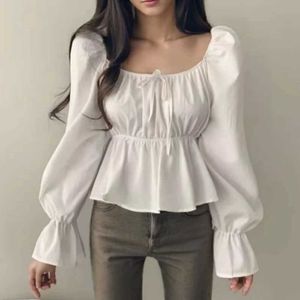 Chemises de chemisiers pour femmes 2024 Fashion Nouveau volant blanc long slved womens blouses couche couche sexy