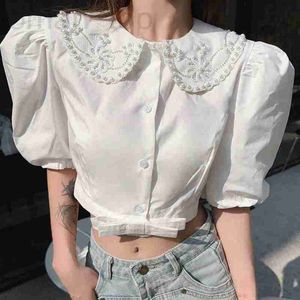 Blouses pour femmes Chemises Designer nouvelle chemise blanche douce fée de style familial miumius avec col de poupée et court incrusté de diamants WN1X