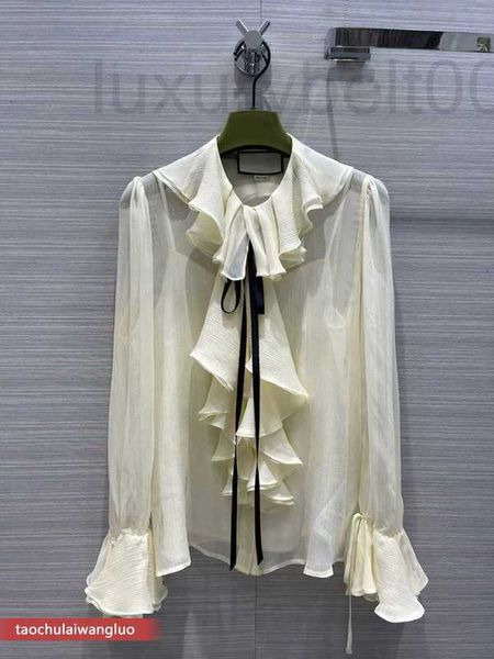 Blusas de mujer Camisas de diseñador Camisa de seda de encaje con volantes Edición coreana Top de manga larga micro transparente de gama alta para mujer A6HK