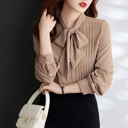 Chemisiers pour femmes tempérament irrégulier arc laçage chemises printemps automne à manches longues solide en mousseline de soie Blouse mode élégante femmes vêtements