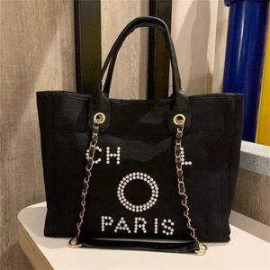 Bolsos de mano de lujo a la moda para mujer, bolso de playa de lona, bolsos de mano, bolsos de cadena pequeños de gran capacidad para mujer, bolso cruzado grande HUPM 60%, venta de salida de fábrica GZY3