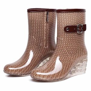 Bottes de pluie imperméables à la cheville en PVC à la mode pour femmes bottes à talon plat chaussures à tête ronde en cuir garder au chaud