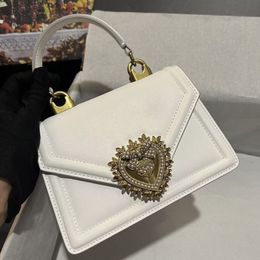 Bolsos de cuero genuino de mujeres Bolsas Crossbody Crossbody Bag Pearl Bowtie Button Bolselas Europeas y Americanas Estilo