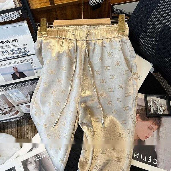 Fajas de pantalones de cintura elástica de las mujeres con tela de satén con estampado con cordón pantalones largos Mlxl