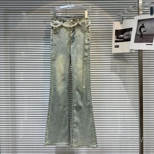 Jeans féminins 2024 Chaînes de ceinture de perle de style classique d'été lavées et usées minceur skinny pour les pantalons de fusées