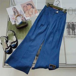 Designer de jeans pour femmes 2023 Printemps / Été Nouveau Pantalon Ourlet Lettre Décoration Taille Haute Style Célébrité Micro La Nine Point FU54