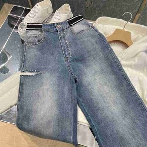 Designer de jeans pour femmes Shenzhen Nanyou haut de gamme MIU Home Automne et Winter Taist Bonebing Décoration polyvalente du trou de tube droit polyvalent jean W7VQ