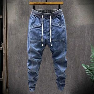 Dames jeans elastische taille jeans voor heren elastische stretch denim vrachtbroek met zakken vaste kleur harembroeken lente en herfst Q240523