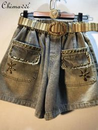 Jeans pour femmes Station européenne 2024 Été lourde industrie perles hautes shorts de taille lâche et rétro-jambes de denim