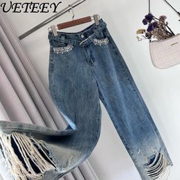 Jeans de jeans femeninos European Station Raged Beld Beld Beld Industria pesada Pantalones de mezclilla de pierna dhinestone pantalones de mezclilla