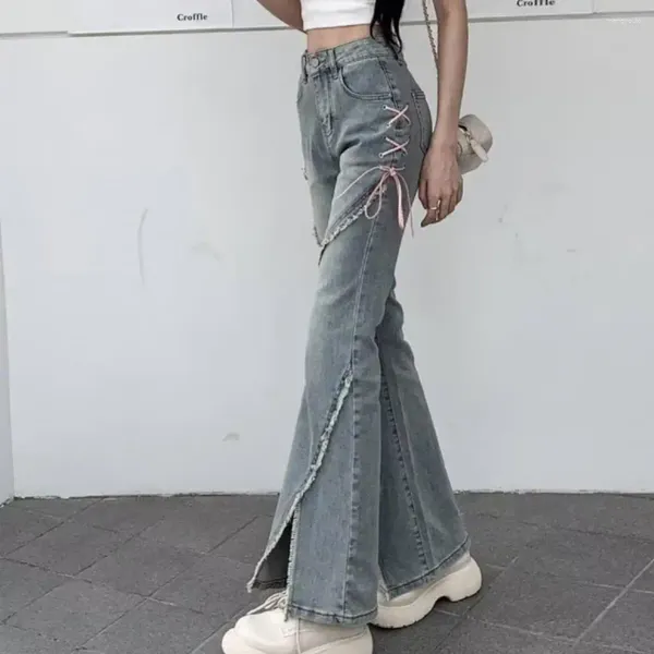 Jeans féminins en jean haute taille haute taille déchirée avec décor de sangle de rythme de street-street de street