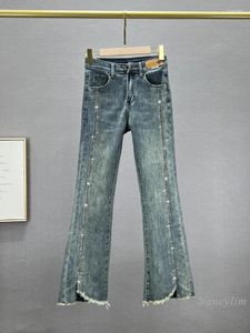 Jeans pour femmes pantalons de bootcut en jean divisé Blue Skinny 2024 Spring High Taist Slim Slive Driling Bell-Bottom Pantal