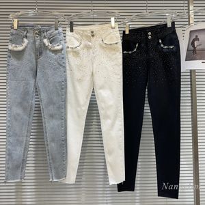Damesjeans Skinny winterjeans Witte jeans voor dames Nieuw Niche Socialite Bontzakken Strass Ultradunne pasvorm Plus Fluweel Warme kokerbroek 231203