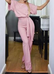 Jumpsuits voor dames rompers elegante lente/zomer dames jumpsuit stevige kleur ronde nek veter strak passende pak met knop korte slave dames jumpsuit y240425