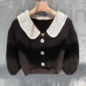 Puntos de mujer Camisetas Diseñador El mismo otoño e invierno Manga de burbuja Muñeca Cuello Cardigan Dulce Edad Reducción de solapa Chaqueta media YB Nuevo estilo K6TJ