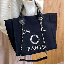 Bolso de playa de lona clásico de lujo para mujer, bolsos de mano, mochilas grandes con capacidad, paquetes de cadena pequeños, bandolera grande 2083 H90