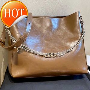 Bolsos de diseñador de lujo para mujer 2023 Nueva moda Bolso de compras de piel de vaca cerosa Portátil Multifuncional Color sólido Bolsos de mensajero de un solo hombro Venta directa de fábrica