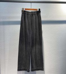 Pantalon féminin automne et hiver un pantalon décontracté classique procédé de lavage des couleurs progressive à l'aide de tissu de coton importé