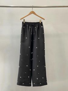 Pantalon femme Style automne et hiver pantalon décoré noir