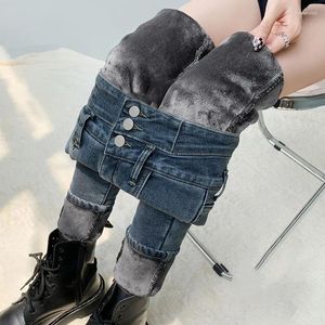 Pantalones de mujer otoño e invernal súper alto cinturón de terciopelo de tres botones jeans de terciopelo ajustable adelgazamiento