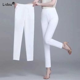 Damesbroek capris zwart witte kleur hoge strint sente zomer potloodbroek pocket decoratie elastische taille plus size drie kwart casual broek y24042222