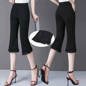 Pantalon féminin Capris Summer Casual Fashion Patch Lace Solid Elastic Taon Gin Cut Pantal pour les femmes Tous assortis à une taille de taille haute irrégulière Y240422