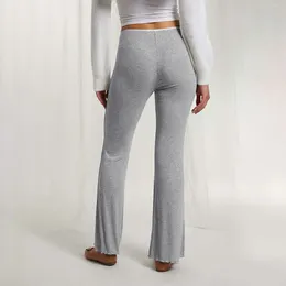 Pantalon de femme en dentelle de commerce extérieur Petites fleurs roulées évasées épicées collision collision à la taille basse yoga extensible loisirs