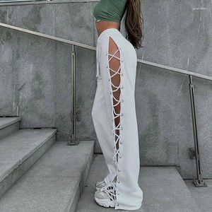 Pantalon féminin couleur couleur élastique taille cordon de crampon à fente élevée bandage tricoté creux pantalon de survêtement décontracté streetwear pantalon féminin