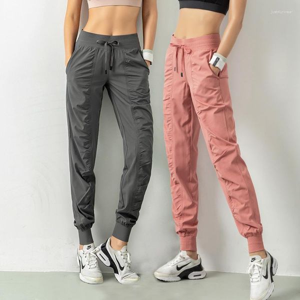 Pantalon féminin froissé des sports de fitness minces de leggings lâches coulant un pantalon à séchage rapide harem