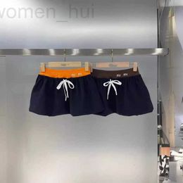 Pantalones cortos para mujer Diseñador Shenzhen Nanyou Desgaste de gama alta Contraste Color Empalme Cintura elástica Moda Falda corta M24 Nuevo Versátil Medio L4NR