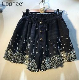 Dames shorts Nieuwe zware industrie Tassel Bead Diamond High Taille Slimming brede pijpen Denim Shorts Dames High Strt Rhinestone Black Shorts Y240420