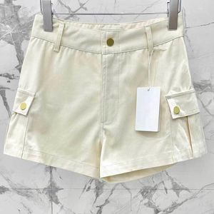 Dames shorts dames solide katoen hoog taille werk mode retro twee zakken metalen knop super korte ritssluiting ontwerpkleding 2 color chic