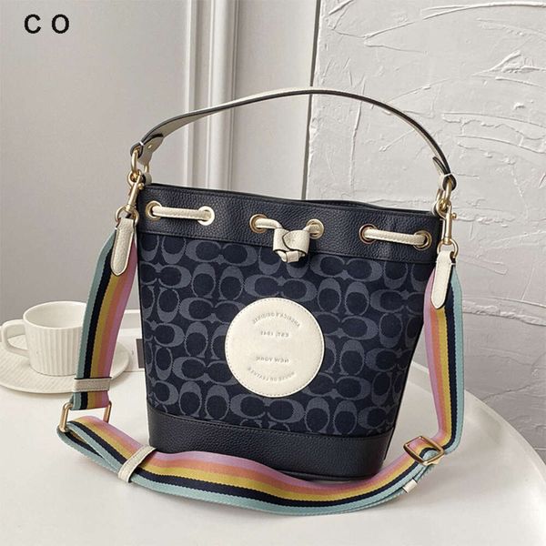 Bolsos de hombro para mujer están a la venta en la fábrica Bolso para mujer Olay Nuevo bolso de lona jacquard de cambray Cubo con cordón Dempsey